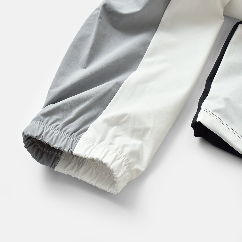 new balance(ニューバランス)ウーブンフーデッドジャケットwj61m2mg